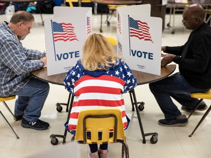 HERNDON, VA - MARCH 03: Voters fill in their ballots for the Democratic presidential prima