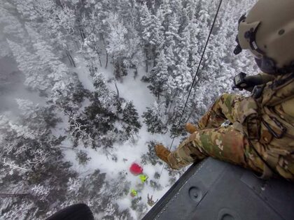 From a hover of 70 feet, Sgt. Daniel Bourque, a medevac crew member with the New Hampshire