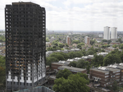 The burnt Grenfell Tower apartment building stands testament to the recent fire in London,