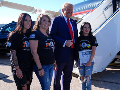 Republican presidential nominee former President Donald Trump greets family members of Cor