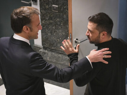 French President Emmanuel Macron, left, speaks with Ukraine's President Volodymyr Zel