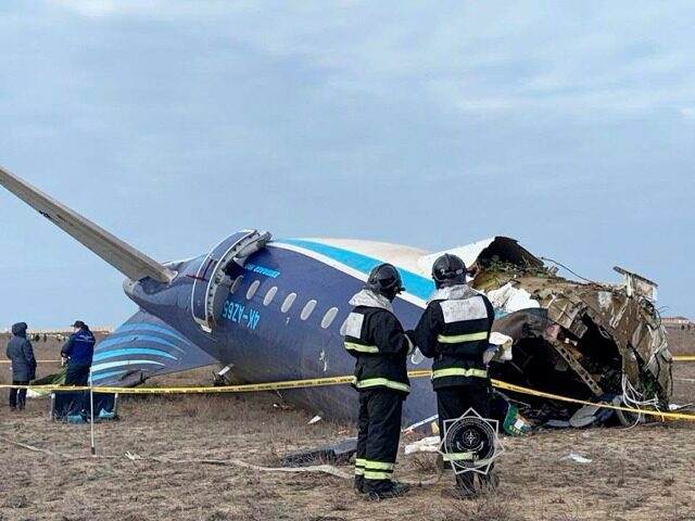 In this photo released by Kazakhstan's Emergency Ministry Press Service, Rescuers work at