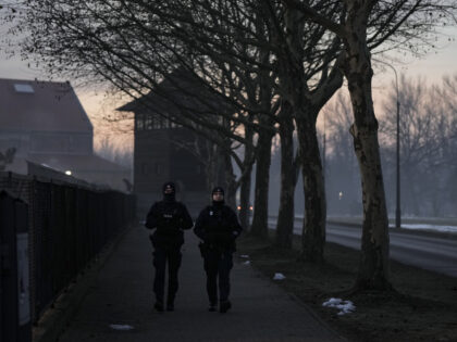 Polish police patrol outside the Auschwitz-Birkenau former Nazi German concentration and e