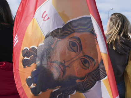 A flag during a student-led 24 hour block on an intersection to protest the deaths of 15 p