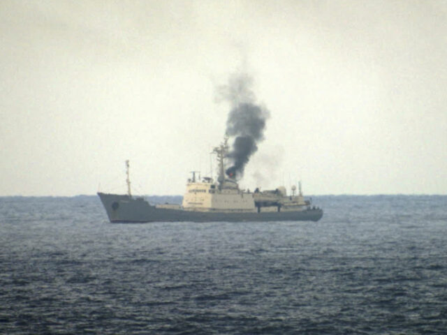 Military officials say this photo taken from a nearby vessel shows smoke rising from a fir