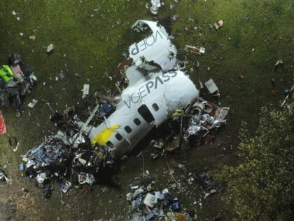 The debris at the site where an airplane crashed with 61 people on board, in Vinhedo, Sao