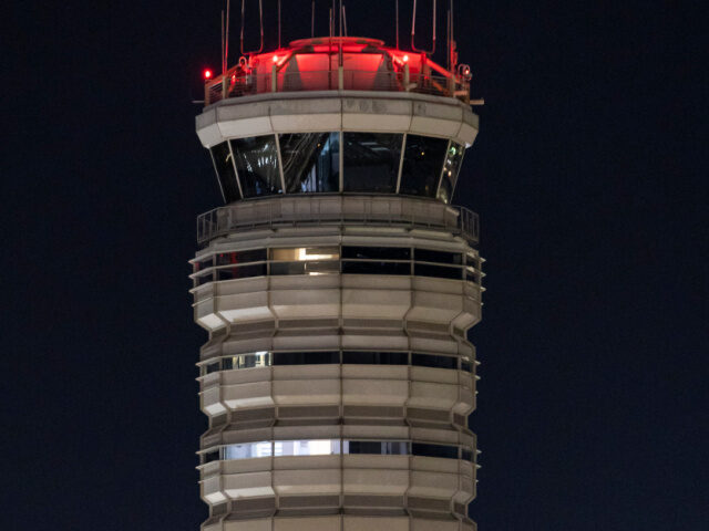 The air traffic control tower of the airport. Exterior night view of Ronald Reagan Washing