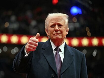 US President Donald Trump give the thumbs up during the inaugural parade inside Capitol On