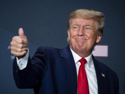 Former US President Donald Trump gives a thumbs up during the America First Policy Institu