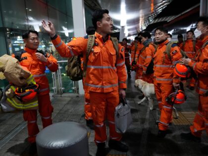 South Korean rescue team members prepare to board a plane for quake-ravaged Turkey at the