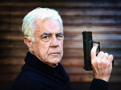 elderly man with gun