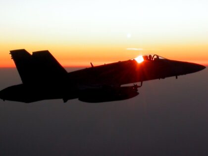 IN FLIGHT - MARCH 27: A U.S. Marine F/A-18 Hornet from the VMFA-323 "Death Rattlers" squad