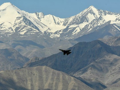 An Indian Air Force aircraft is seen against the backdrop of mountains surrounding Leh, th