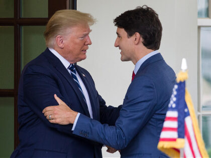 FILE - President Donald Trump greets Canadian Prime Minister Justin Trudeau upon his arriv