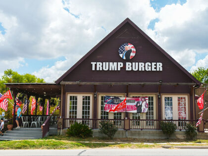 People walk out of Trump Burger after having lunch at the restaurant Thursday, July 28, 20