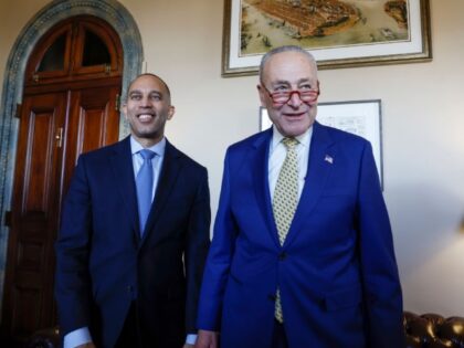 Senate Majority Leader Chuck Schumer (D-NY) (R) speaks in his office with Rep. Hakeem Jeff