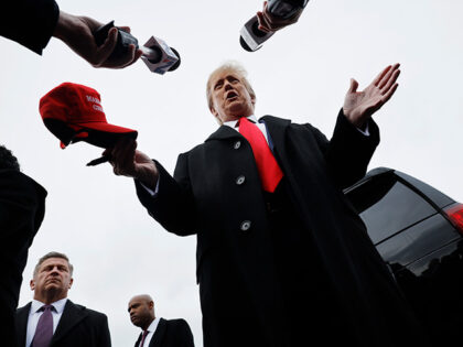 Republican presidential candidate, former U.S. President Donald Trump talks to reporters w