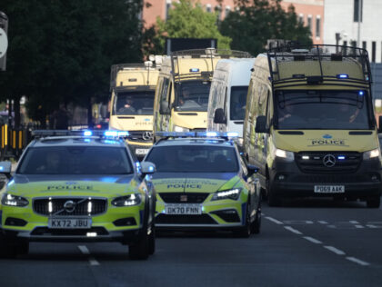 LIVERPOOL, ENGLAND - AUGUST 1: Multiple police vehicles escorting the van carrying the tee