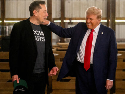 Elon Musk, chief executive officer of Tesla Inc., left, and former US President Donald Tru