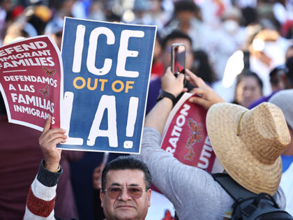 Immigrant rights supporters prepare to march to an ICE detention center on International M