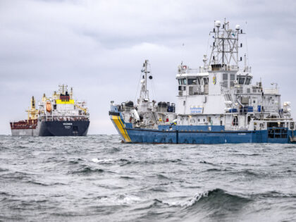 Swedish Coast Guard vessel KBV033 (R) and vessel Vezhen are anchored outside Karlskrona, S