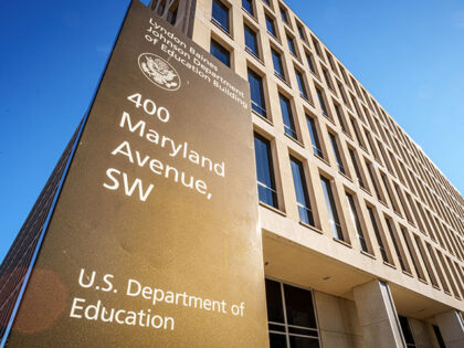 A sign marks the location of the U.S. Department of Education headquarters building on Jan