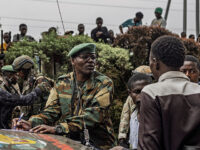 An M23 officer talks to prospective recruits in Goma on February 6, 2025. More than a week