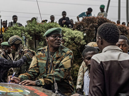 An M23 officer talks to prospective recruits in Goma on February 6, 2025. More than a week