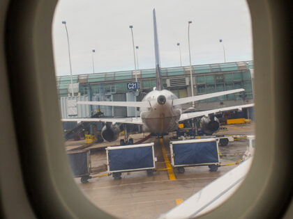 An United Airlines plane is viewed through a plane window January 17, 2014 at O'Hare Airpo