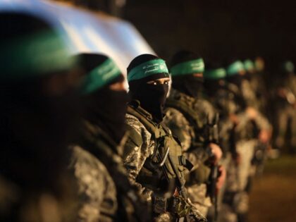 TOPSHOT - Palestinian members of the Ezzedine al-Qassam Brigades, the armed wing of the Ha