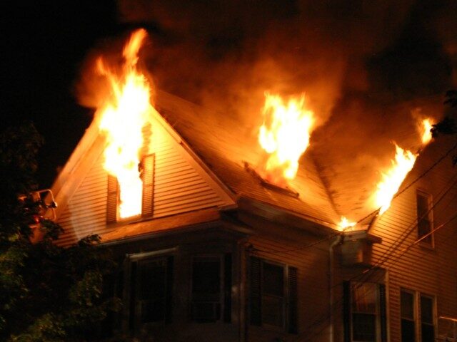 "5:27am, 2-1/2 story wood frame with heavy fire showing on floor number 3. Beverly, Massac