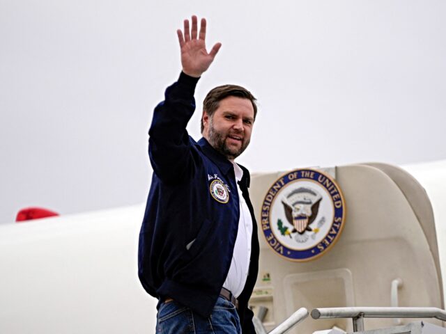 Vice President JD Vance waves as he boards Air Force Two to depart from Tri-Cities Airport