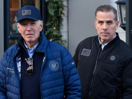 A November 29, 2024 photo shows US President Joe Biden and son Hunter Biden stepping out o