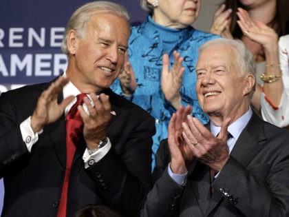 Former President Jimmy Carter, right, is seen with Democratic vice presidential candidate