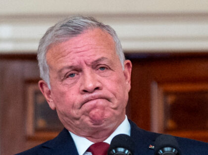 Jordan's King Abdullah II, accompanied by President Joe Biden, right, pauses while sp