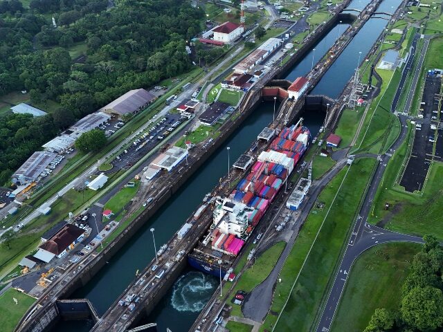 FILE - A cargo ship traverses the Agua Clara Locks of the Panama Canal in Colon, Panama, S