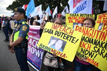 Protesters rally in front of the House of Representatives in Manila calling for Vice Presi