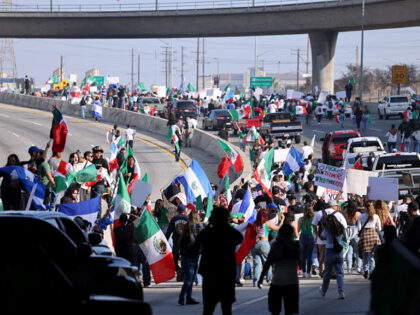 Protestors block the Santa Ana Freeway during a demonstration in support of immigrants in