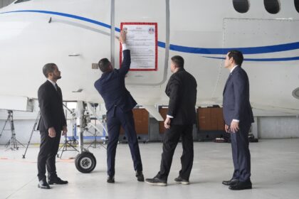 A “seized” sign is placed on a Venezuelan government airplane during a press conferenc