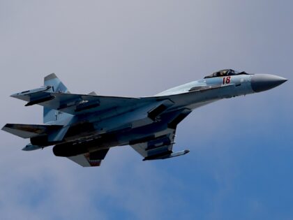 MOSCOW, RUSSIA - MAY 7: Sukhoi Su-35S flies over the Kremlin during the general rehearsals