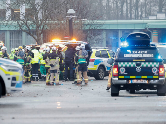 Members of the emergengy services work at the scene of the Risbergska School in Orebro, Sw