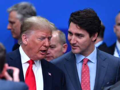 US President Donald Trump (L) talks with Canada's Prime Minister Justin Trudeau during the