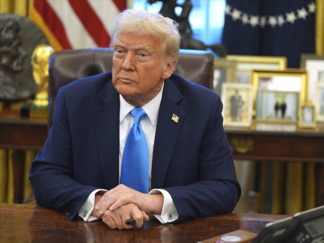 President Donald Trump speaks to reporters as he signs executive orders in the Oval Office