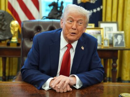 President Donald Trump speaks after signing an executive order in the Oval Office of the W