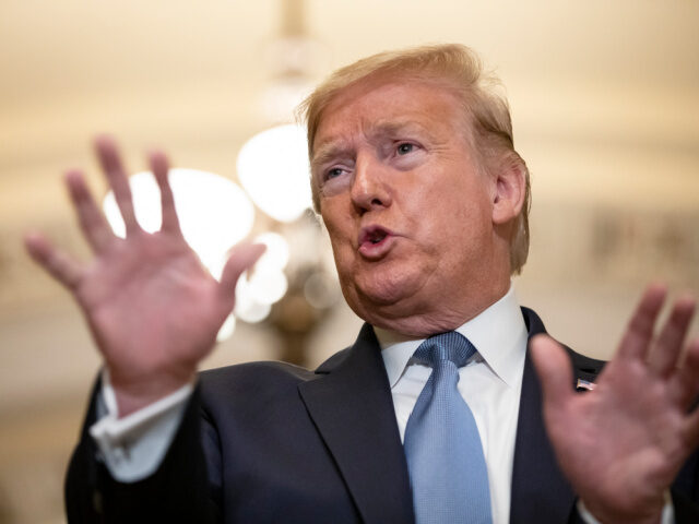 President Donald Trump talks to reporters at the US Capitol after attending the Senate Rep