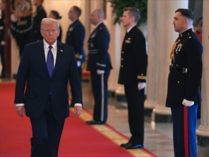 President Donald Trump arrives to sign the Laken Riley Act in the East Room of the White H